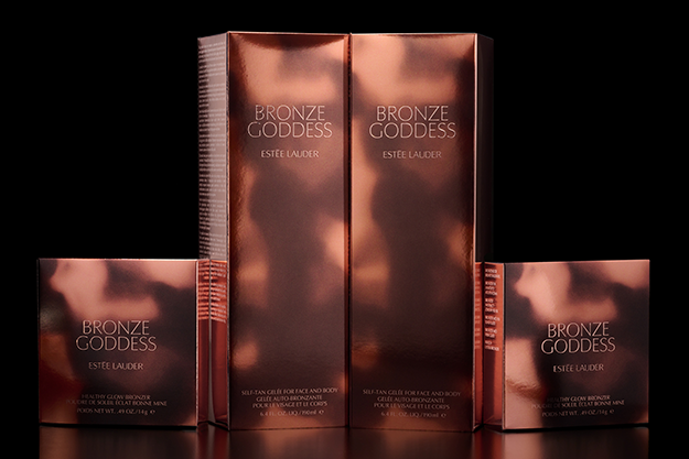 Estee Lauder Bronze Goddess fragrances in glossy copper colored packaging